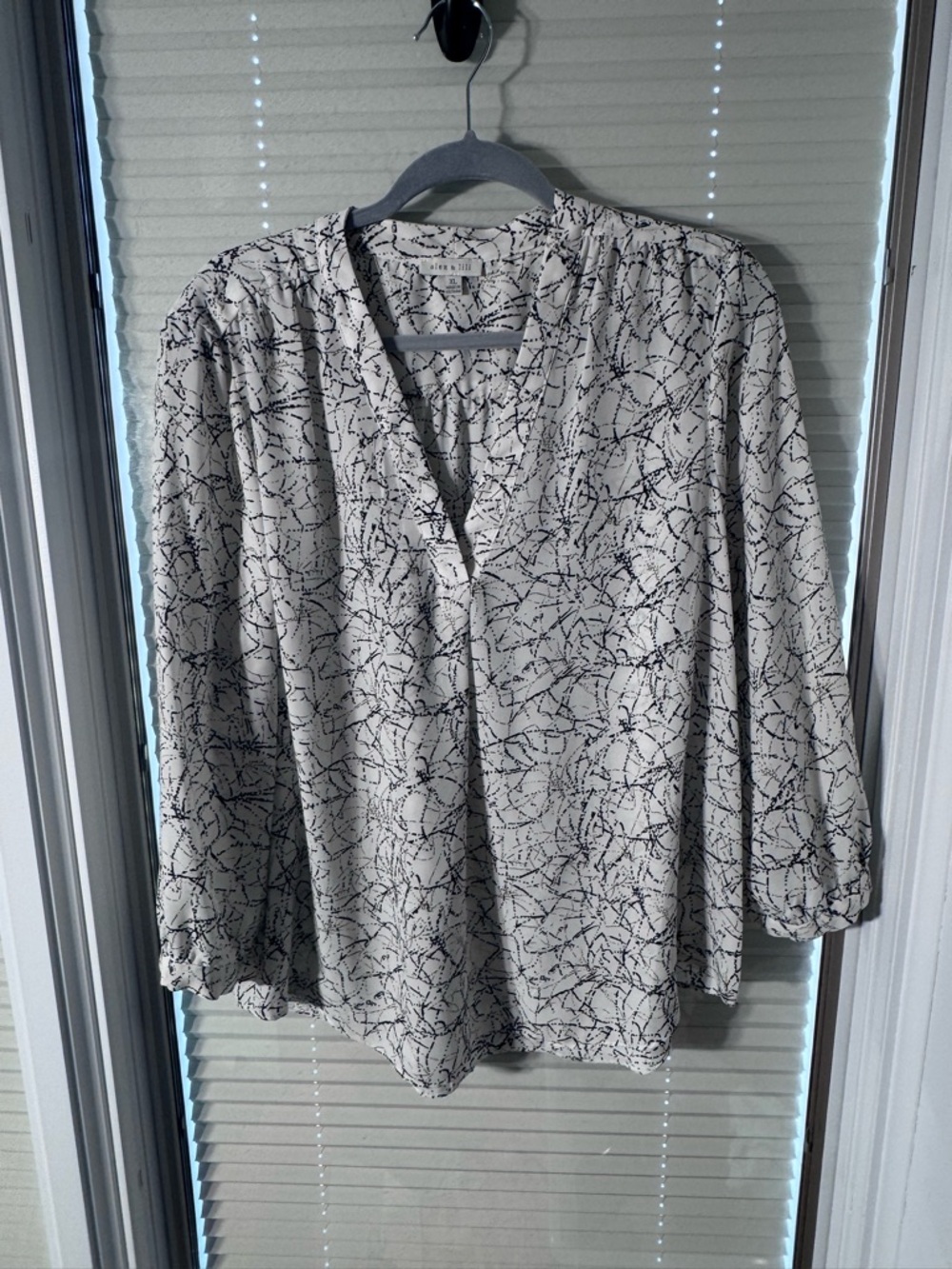 Cream and Black Abstract V-Neck Blouse